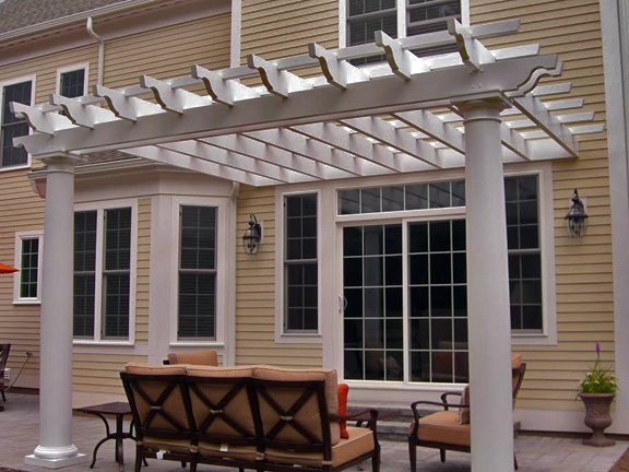 This image shows an attached fiberglass pergola