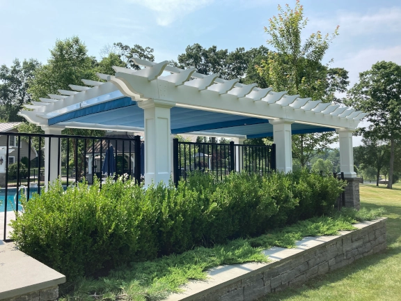 Poolside fiberglass pergola with canopy in Connecticut