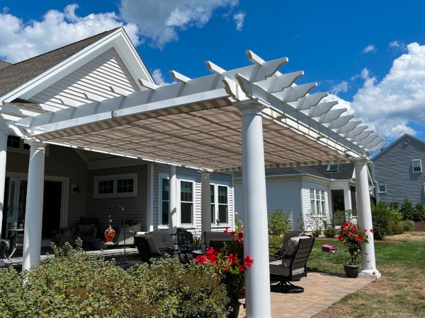 A fiberglass pergola with an overhead shade